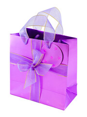 Empty glossy pink gift bag decorated with violet ribbons and a bow, isolated on white