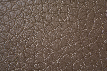 Beige leather on the chair (macro, texture, background)