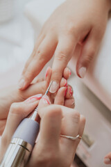 Manicurist , hands closeup. Professional manicure in beauty salon. Hygiene and care for hands....
