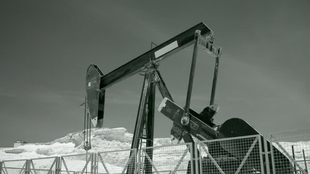 Oil pump working in the desert, shot in infrared