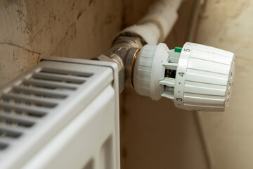 Russia. Saint-Petersburg. Major repairs of heat supply systems of a residential building. Radiator with regulator.