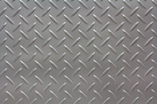 Silver painted metallic plate anti slip surface. Metal diamond plate texture.