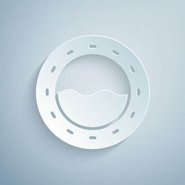 Paper cut Ship porthole with rivets and seascape outside icon isolated on grey background. Paper art style. Vector