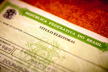 In this photo illustration the Voter License (Título Eleitoral). It is a document that proves that the person is able to vote in Brazil elections. Photo election vote card (voter id).