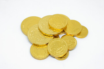 Golden coins chocolate isolated on white background.