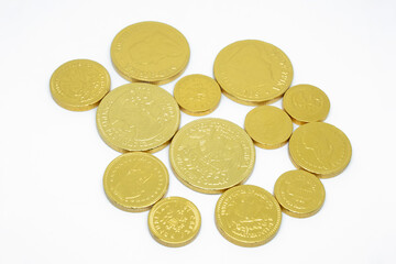 Golden coins chocolate isolated on white background.