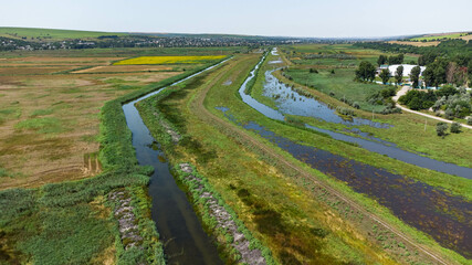 Irrigation canal. Rural farm landscape