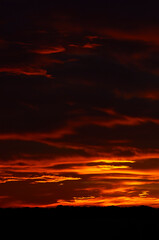 Red clouds at sundown like a burning sky of a spectacular sunset from La Savina (Formentera, Pityusic Islands, Balearic Islands, Mediterranean sea, Spain)