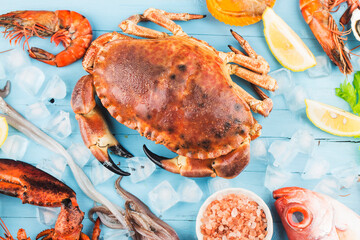 Seafood dinner, seafood dinner with fresh lobster, crab, mussel and oyster as background