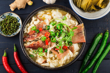 Chinese food:boiled fish with pickled cabbage and chili. Red grouper fillets