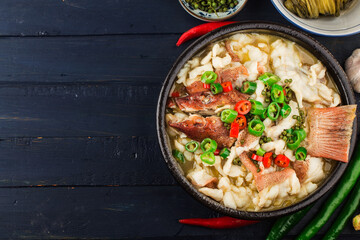 Chinese food:boiled fish with pickled cabbage and chili. Red grouper fillets