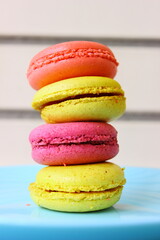 colorful macaroons on brick wall background