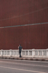 A man walking on the street in the city.