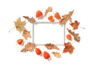 Blank photo frame, physalis flowers, dried maple and oak leaves isolated on white background. Autumn, fall, thanksgiving day concept. Flat lay. Top view. Copy space.