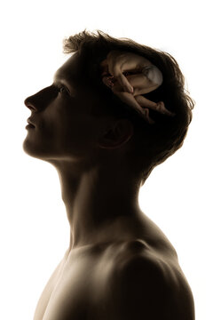 Conceptual image with silhouette of young man and pictures in his head with secrets of subconsciousness, human microcosm. Artwork.