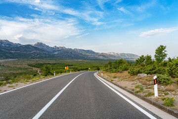 Scenic road. The road is surrounded by a magnificent natural landscape.