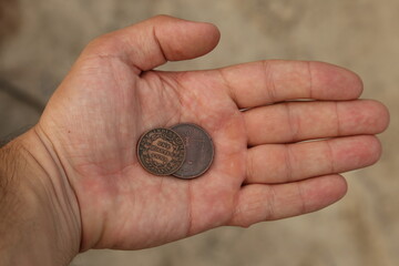 Old indian coins in hand