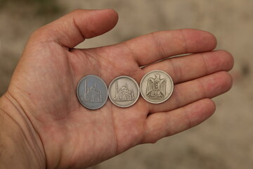 Old arab coins in hand
