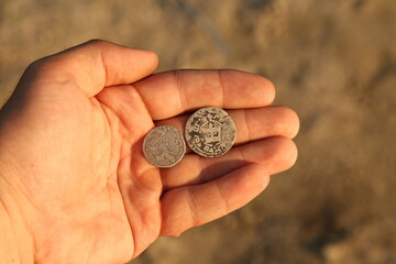 Medieval european silver coins in hand