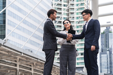 Businessmen and business woman shaking hands during a meeting with reach an agreement for business,Handshake Gesturing People Connection Deal Concept