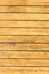Old dirty yellow wooden background. Abstract vertical background. Top view, copy space
