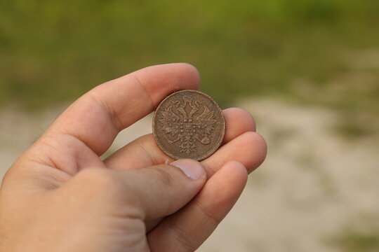 Old Russian copper coin in hand