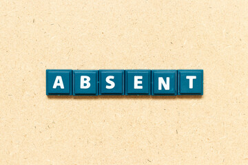 Tile alphabet letter in word absent on wood background