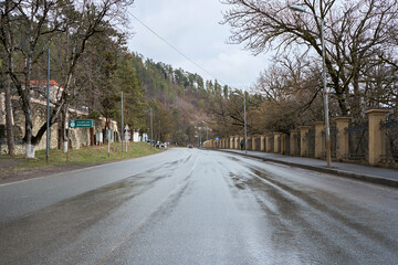 Wet asphalt road after rain, no cars