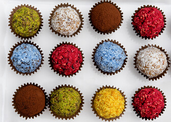 colourful vegetarian sweet balls on white background 
