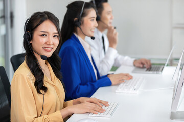 portrait woman operator wearing headphones for working at call center service