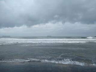 waves on the beach, Kovalam beach, dark cloudy sky, seascape view, Thiruvananthapuram Kerala