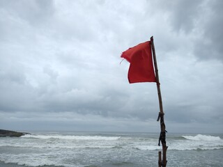 Warning Red flag on the beach, Kovalam beach, seascape view, Thiruvananthapuram Kerala