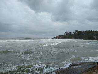 waves on the beach, Kovalam beach, dark cloudy sky, seascape view, Thiruvananthapuram Kerala