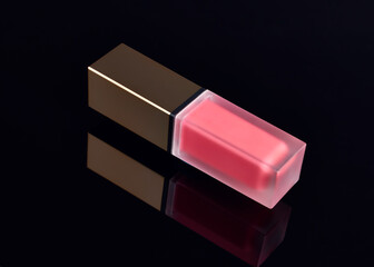 Red Pink lip gloss with black background . Cosmetics, beauty, fashion, make-up, makeup, lipstick.