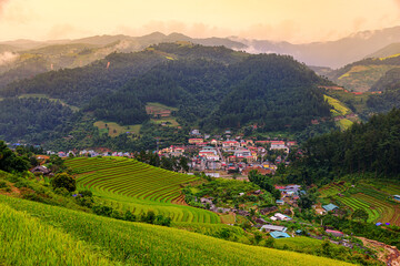 Fototapeta premium Rice fields on terraced beautiful shape of Mu Cang Chai, YenBai, Vietnam. Rice fields prepare the harvest at Northwest Vietnam.