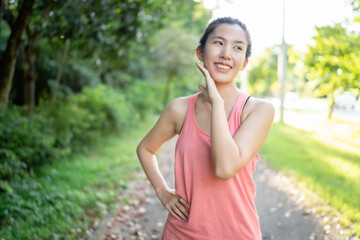 Fototapeta premium Asian women exercise at the park, use the equipment to exercise and stay fit, healthy and in good shape.
