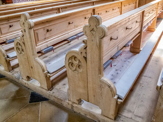 Empty wooden pews in St. John the Baptist Church in Oberstdorf, Germany