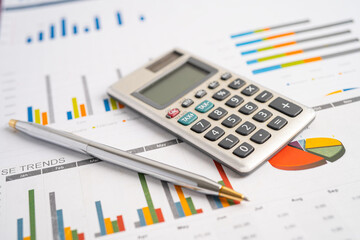 Obraz premium Calculator on graph paper. Finance development, Banking Account, Statistics, Investment Analytic research data economy, Stock exchange trading, Business company concept.