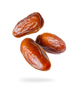 Dried Dates Close Up In The Air On A White Background