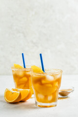 Honey orange iced green tea,  summer cold cocktails in glasses. Space for text.