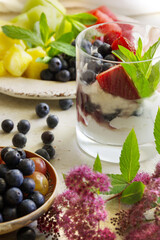 Fruit salad and natural greek yogurt with fresh berries. Healthy eating, healthy lifestyle.