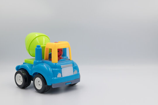 Cement mixture construction toy in blue, yellow and green colour. Children play construction toy with isolated white background