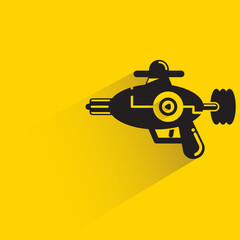 space blaster gun or fantastic raygun icon on yellow background