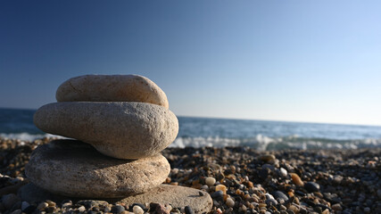 Lined stones on the background of the sea