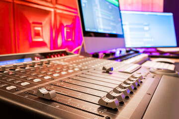 close up audio mixing console fader in home recording studio. music background. recording and broadcasting concept © princeoflove