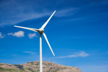 Fototapeta na wymiar Wind generator turbines in sky