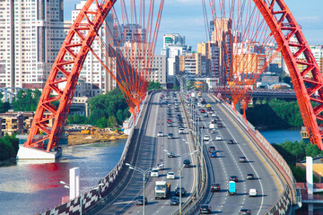 The picturesque bridge over the Moscow River (Zhivopisny Bridge) and a 
car traffic over it