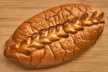 Bread pie bakery close up on wood background top view