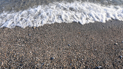 Sea water on the beach, top view