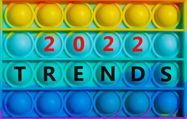 Trends planning 2022 new year symbol. Words 'Trends 2022' on rainbow Pop It. Beautiful background, copy space. Business and Trends 2022 new year concept.